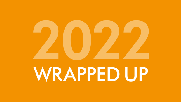 Orange background with '2022' written in lighter orange writing and 'wrapped up' written in white writing.