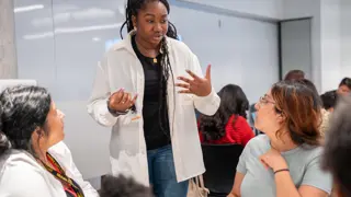 A volunteer from Dyson working with teachers.