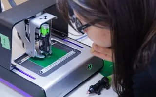 An engineer working on a machine.